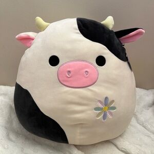 Squishmallow Connor cow with flower
embroidery